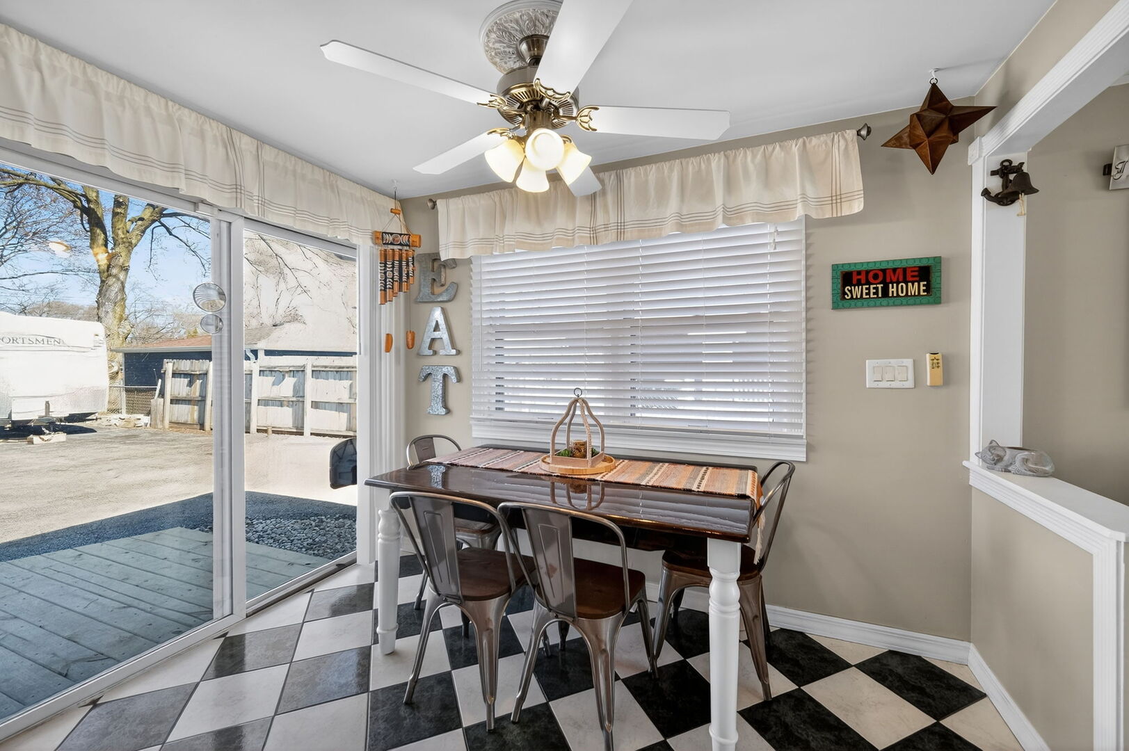 407 Butterfield Road North Aurora, IL 60542 - Photo 12 of 50 a view of a dining room with furniture and a chandelier