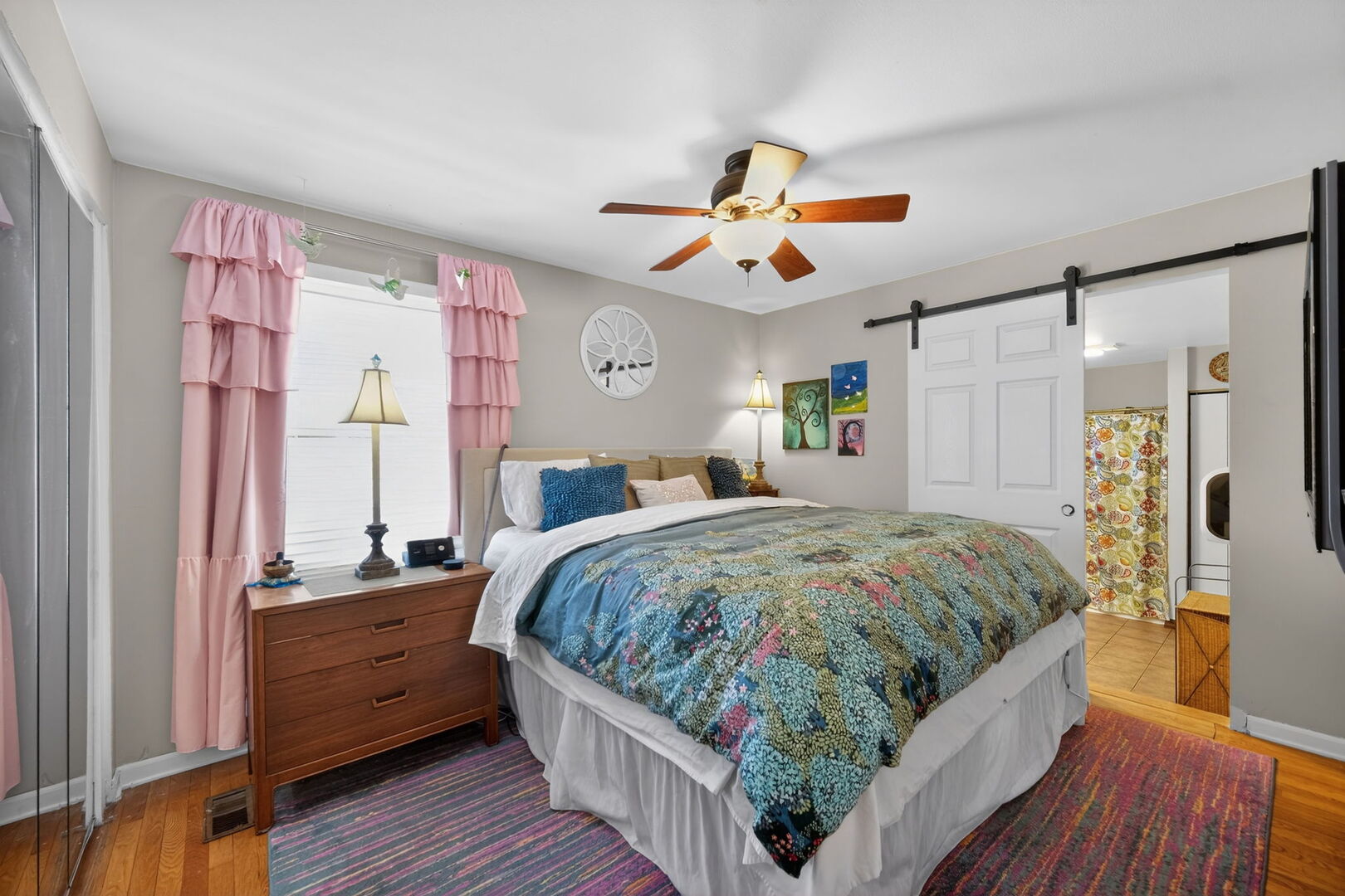 407 Butterfield Road North Aurora, IL 60542 - Photo 18 of 50 a bedroom with a bed and a chandelier