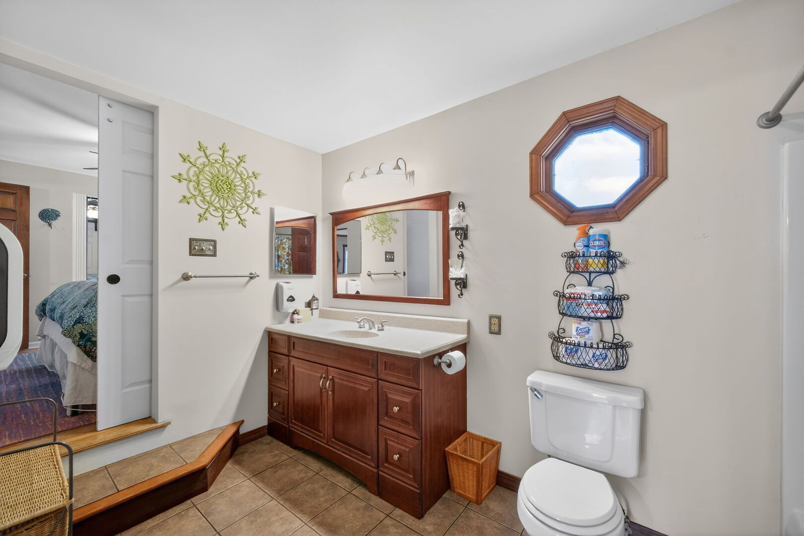 407 Butterfield Road North Aurora, IL 60542 - Photo 20 of 50 a spacious bathroom with a toilet a sink and a mirror