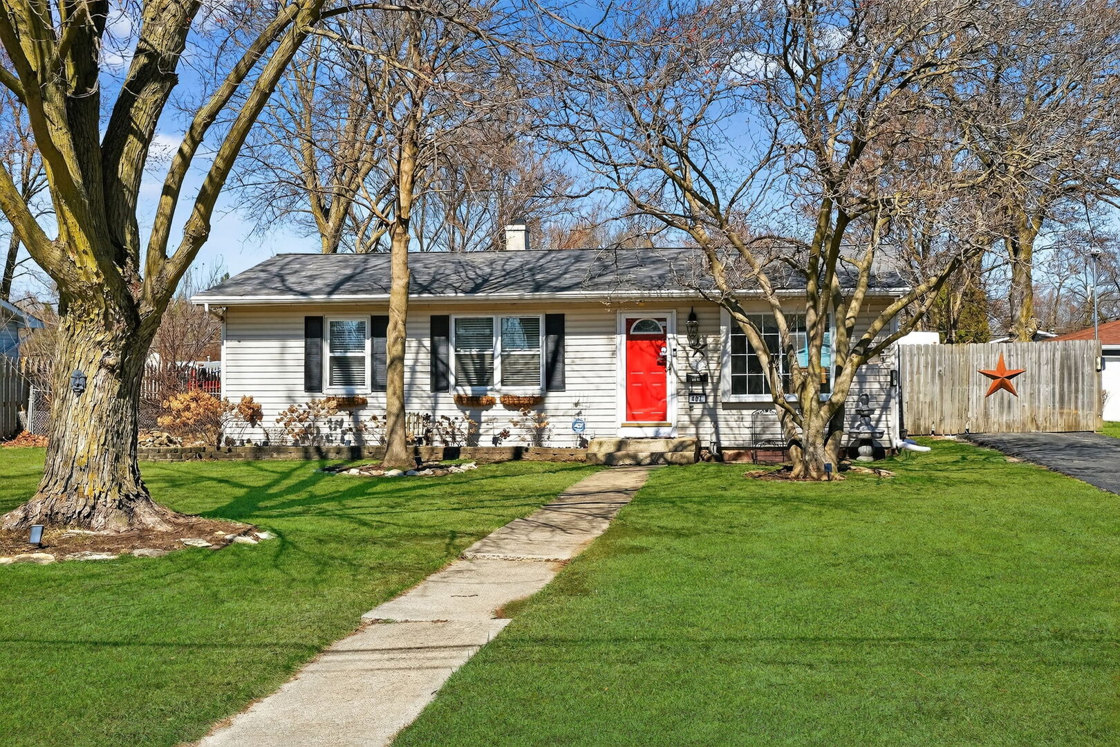 407 Butterfield Road North Aurora, IL 60542 - Photo 2 of 50 a front view of a house with a yard