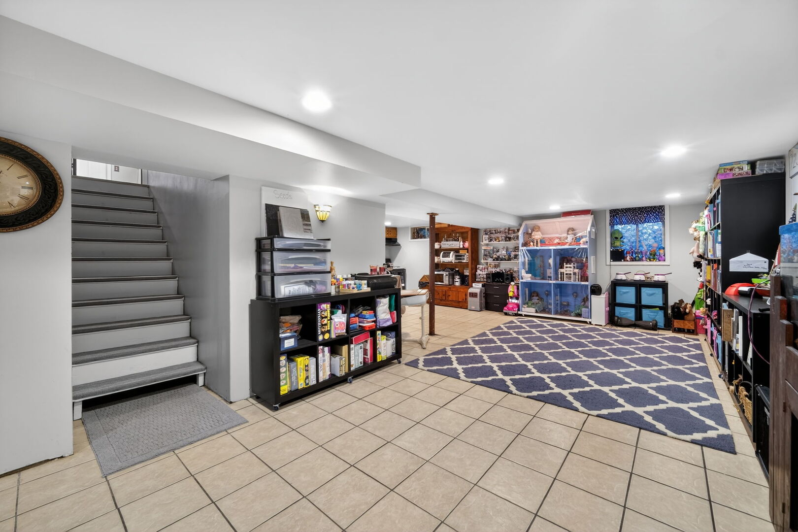 407 Butterfield Road North Aurora, IL 60542 - Photo 23 of 50 a bed room with a bed and a flat screen tv