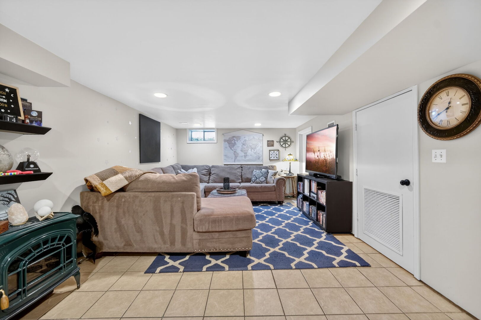 407 Butterfield Road North Aurora, IL 60542 - Photo 24 of 50 a living room with furniture and a flat screen tv
