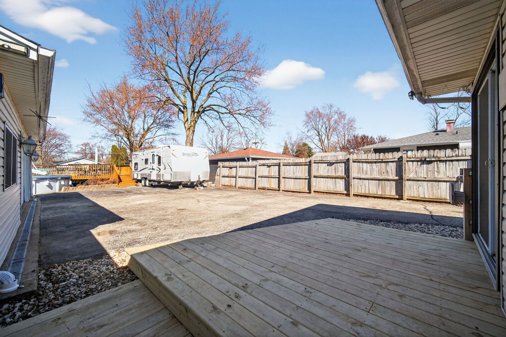 407 Butterfield Road North Aurora, IL 60542 - Photo 32 of 50 a view of outdoor space with wooden floor and flat screen tv