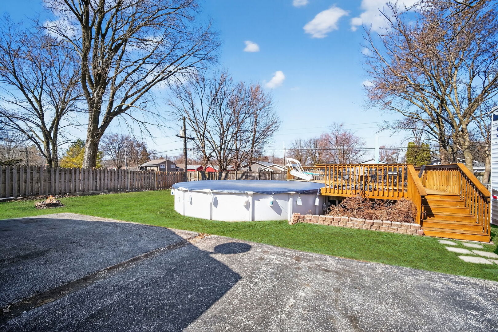 407 Butterfield Road North Aurora, IL 60542 - Photo 34 of 50 a view of a house with a big yard and large trees