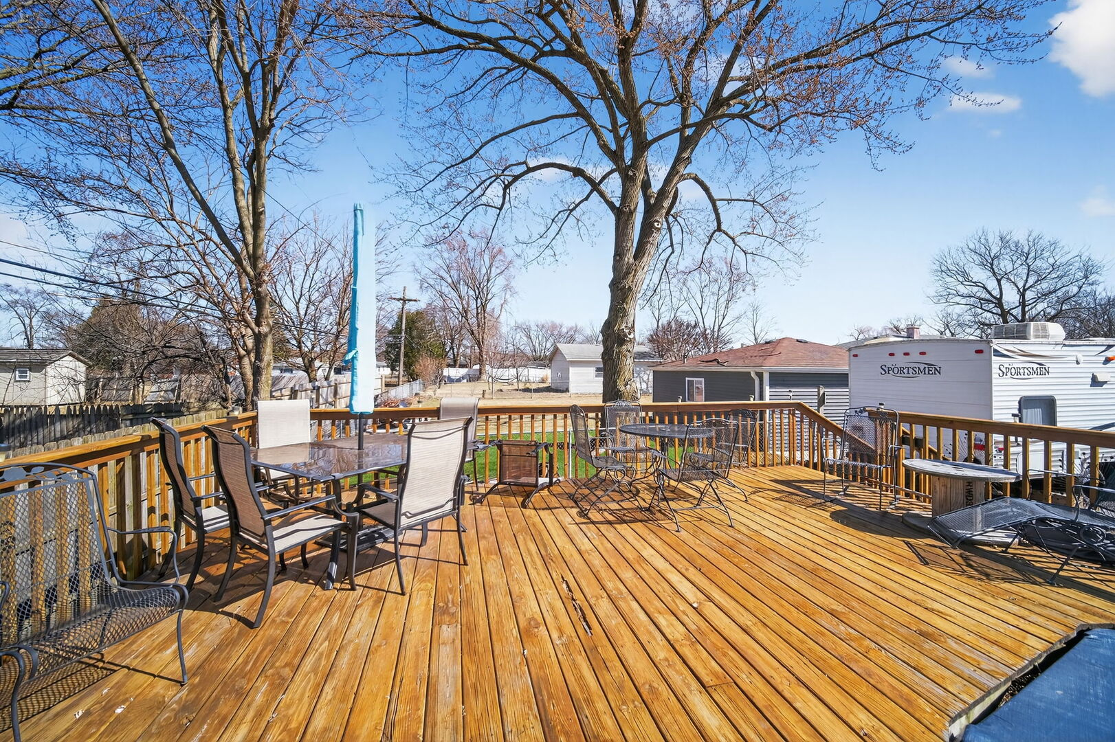 407 Butterfield Road North Aurora, IL 60542 - Photo 39 of 50 a view of a patio with table and chairs and wooden floor