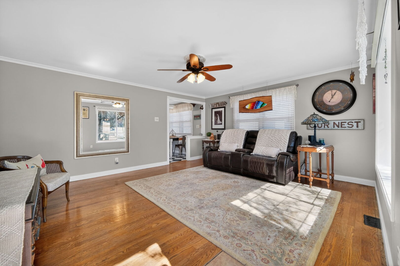 407 Butterfield Road North Aurora, IL 60542 - Photo 5 of 50 a living room with furniture a rug and a chandelier