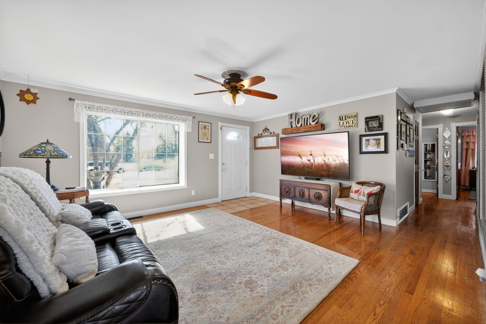 407 Butterfield Road North Aurora, IL 60542 - Photo 7 of 50 a living room with furniture and a flat screen tv