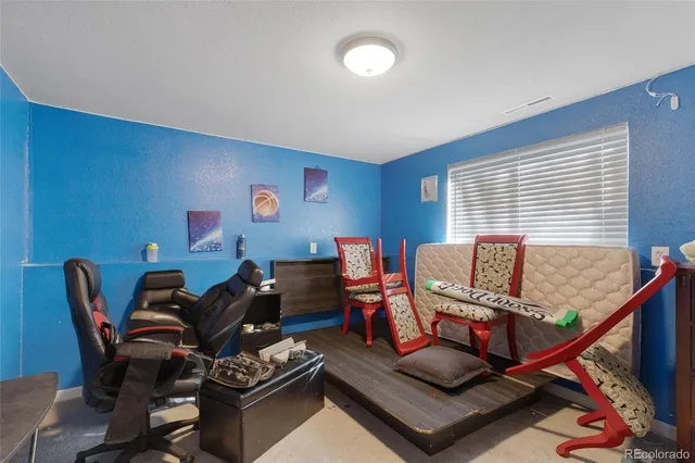 a view of a white house with a yard covered with snow in front of house