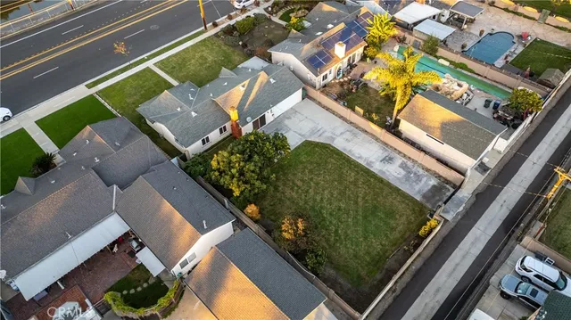 an aerial view of a residential houses with outdoor space