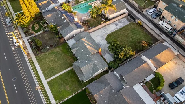 an aerial view of a residential houses with outdoor space