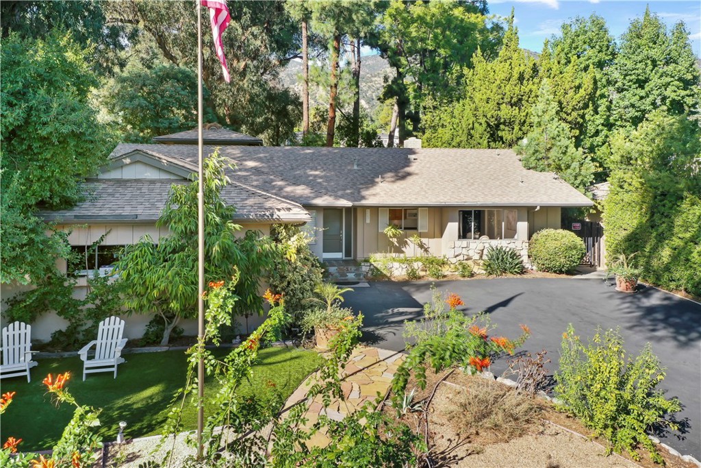 1237 Olive Lane La Canada Flintridge, CA 91011 - Photo 2 of 57 a front view of a house with garden