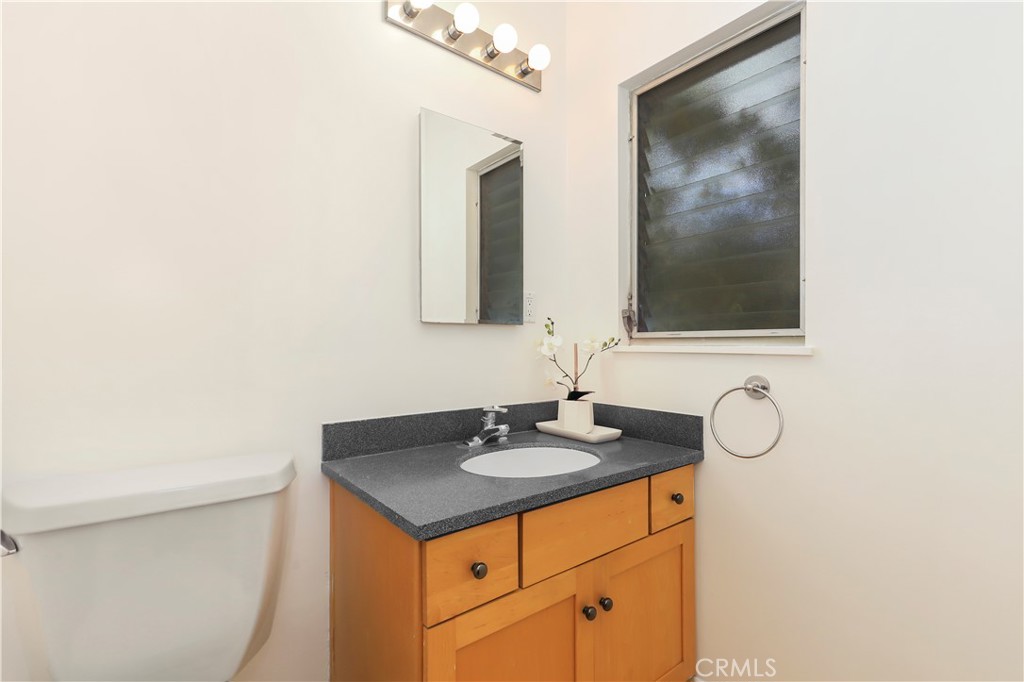 1237 Olive Lane La Canada Flintridge, CA 91011 - Photo 26 of 57 a bathroom with a sink and a mirror