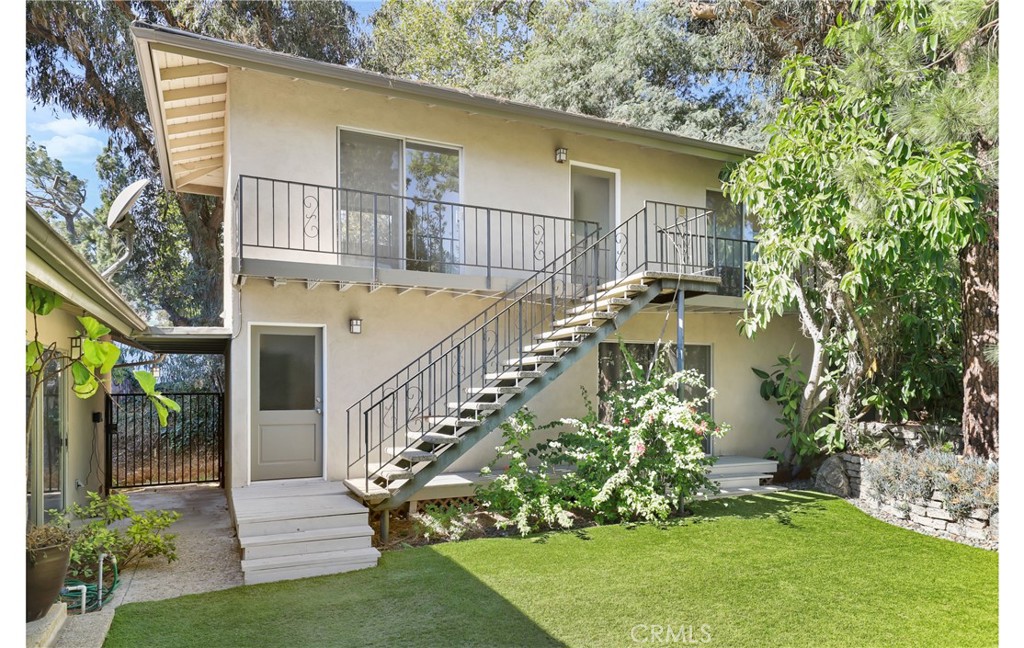 1237 Olive Lane La Canada Flintridge, CA 91011 - Photo 38 of 57 a view of a house with brick walls and a yard with plants