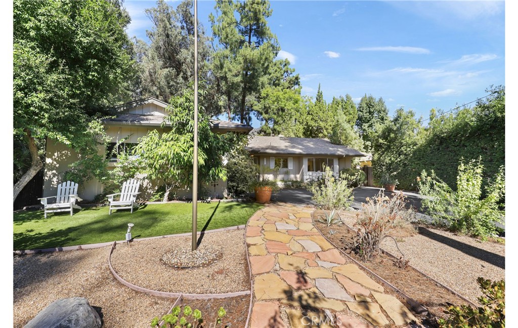 1237 Olive Lane La Canada Flintridge, CA 91011 - Photo 4 of 57 a view of a patio with a table and chairs under an umbrella