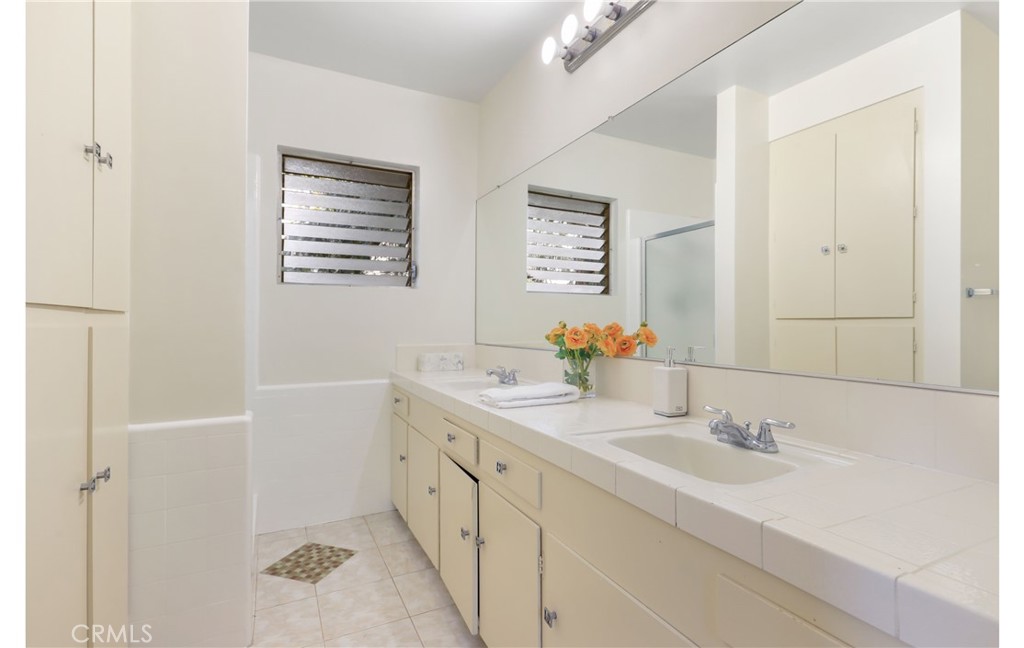 1237 Olive Lane La Canada Flintridge, CA 91011 - Photo 41 of 57 a bathroom with a sink and a mirror
