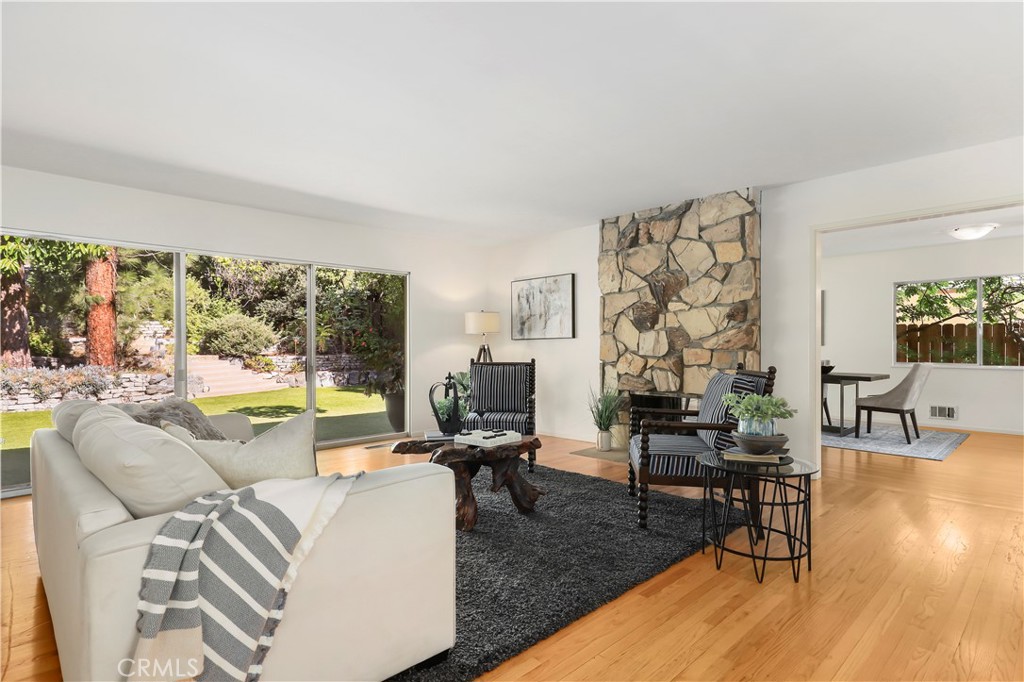 1237 Olive Lane La Canada Flintridge, CA 91011 - Photo 8 of 57 a living room with fireplace furniture and a large window