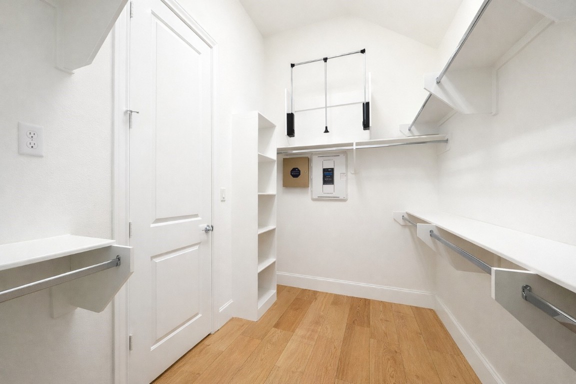 737 Bringhurst Street Houston, TX 77020 - Photo 8 of 13 Huge primary closet (1 of 2) with shelving all around and pulldowns create even more space.