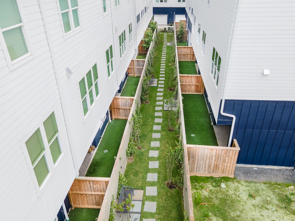737 Bringhurst Street Houston, TX 77020 - Photo 9 of 13 Courtyard area behind your private fenced in back yard. Walk the dog or sit on a bench and relax.