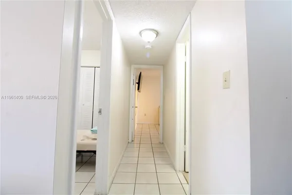 a bathroom with a glass door shower