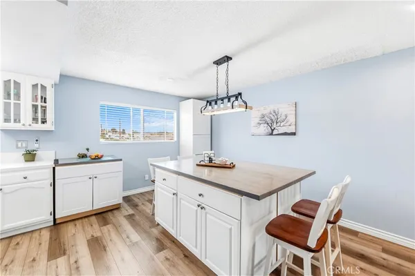 a kitchen with stainless steel appliances granite countertop a sink and cabinets