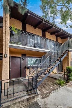 an outdoor space with swimming pool and furniture