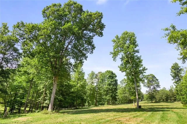 a view of a house with backyard from a balcony