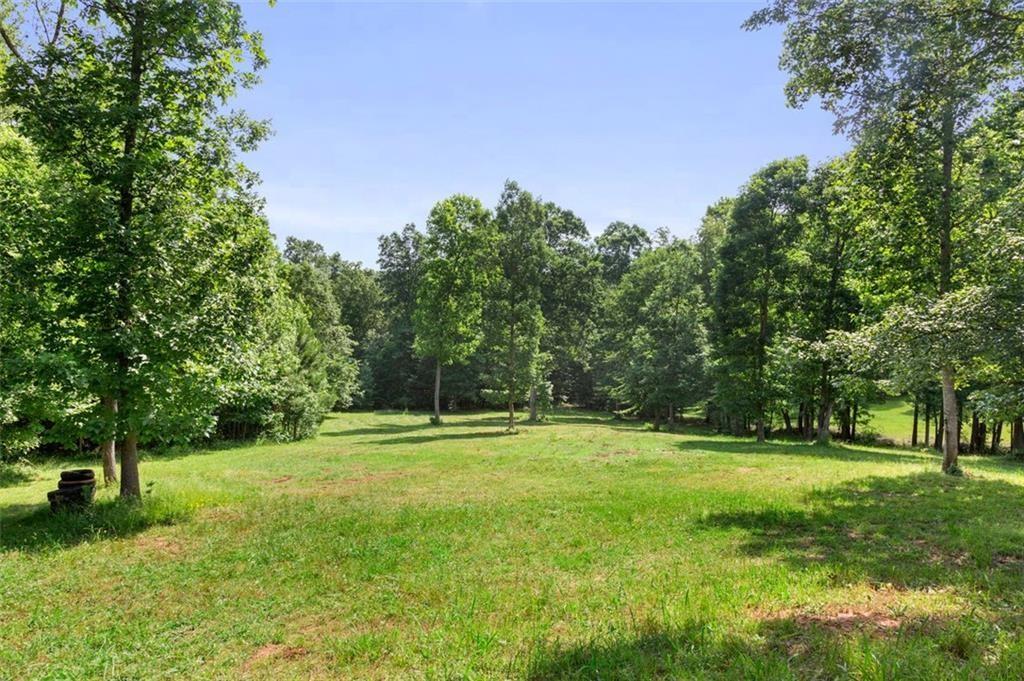3030 Demooney Road College Park, GA 30349 - Photo 4 of 35 a backyard of a house with lots of green space and fountain