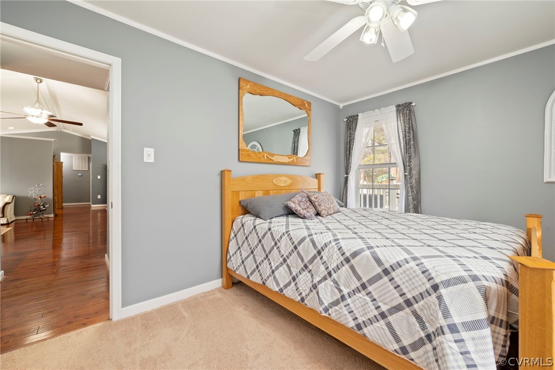 12311 Lewis Road Chester, VA 23831 - Photo 11 of 30 a bedroom with a bed and a chandelier