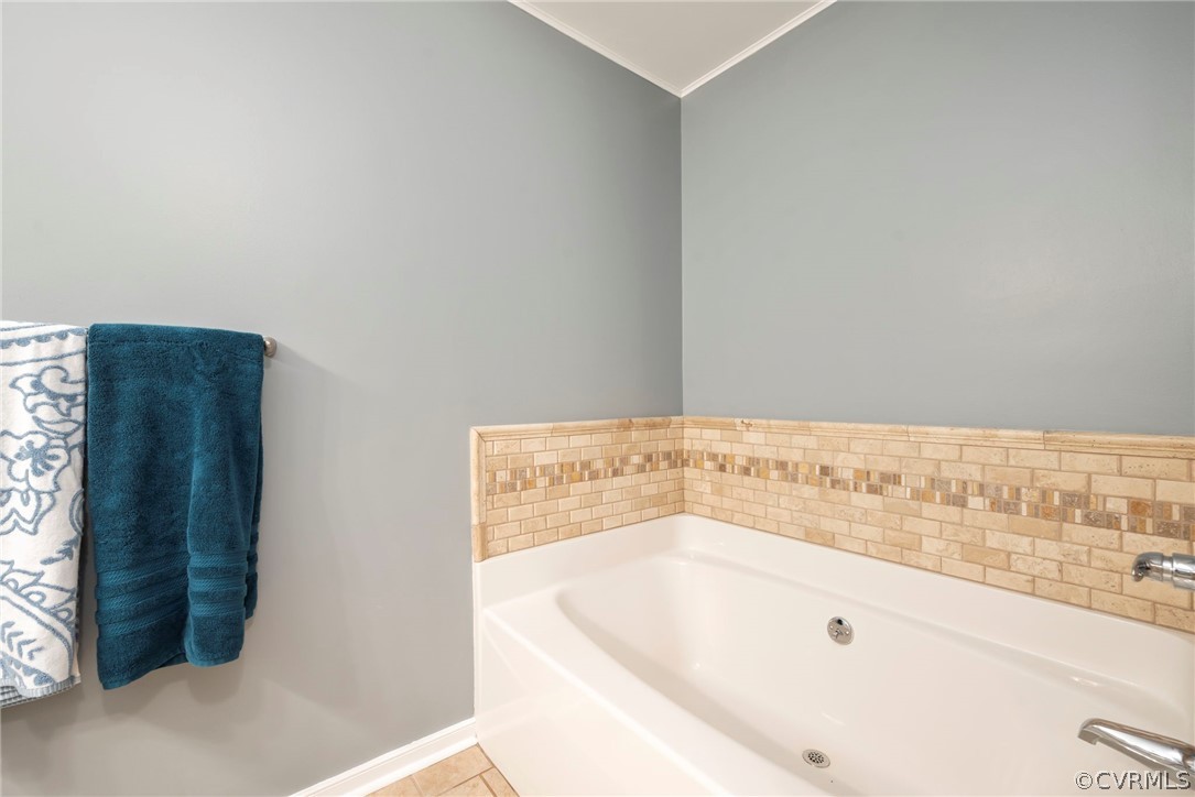 12311 Lewis Road Chester, VA 23831 - Photo 17 of 30 a bathroom with a bathtub and a shower