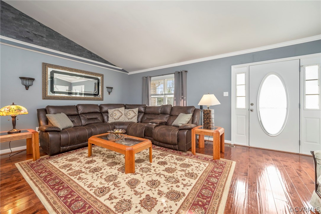 12311 Lewis Road Chester, VA 23831 - Photo 3 of 30 a living room with furniture a rug and wall painting