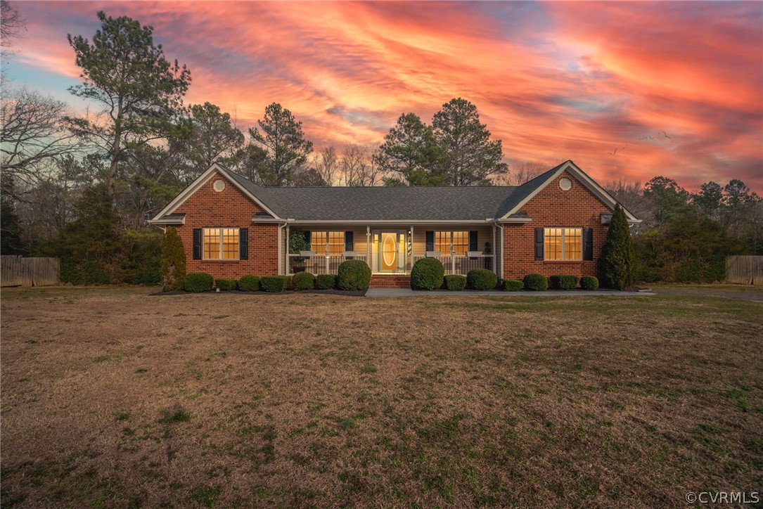12311 Lewis Road Chester, VA 23831 - Photo 7 of 30 a front view of a house with a yard and large tree