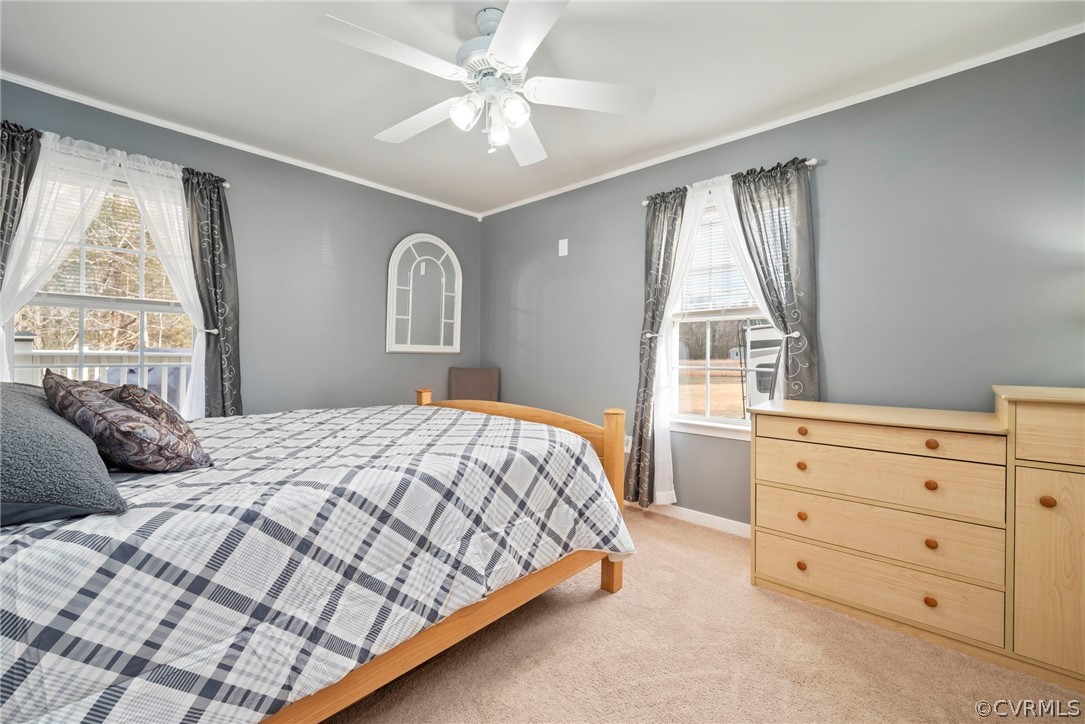 12311 Lewis Road Chester, VA 23831 - Photo 10 of 30 a bedroom with a large bed and a window