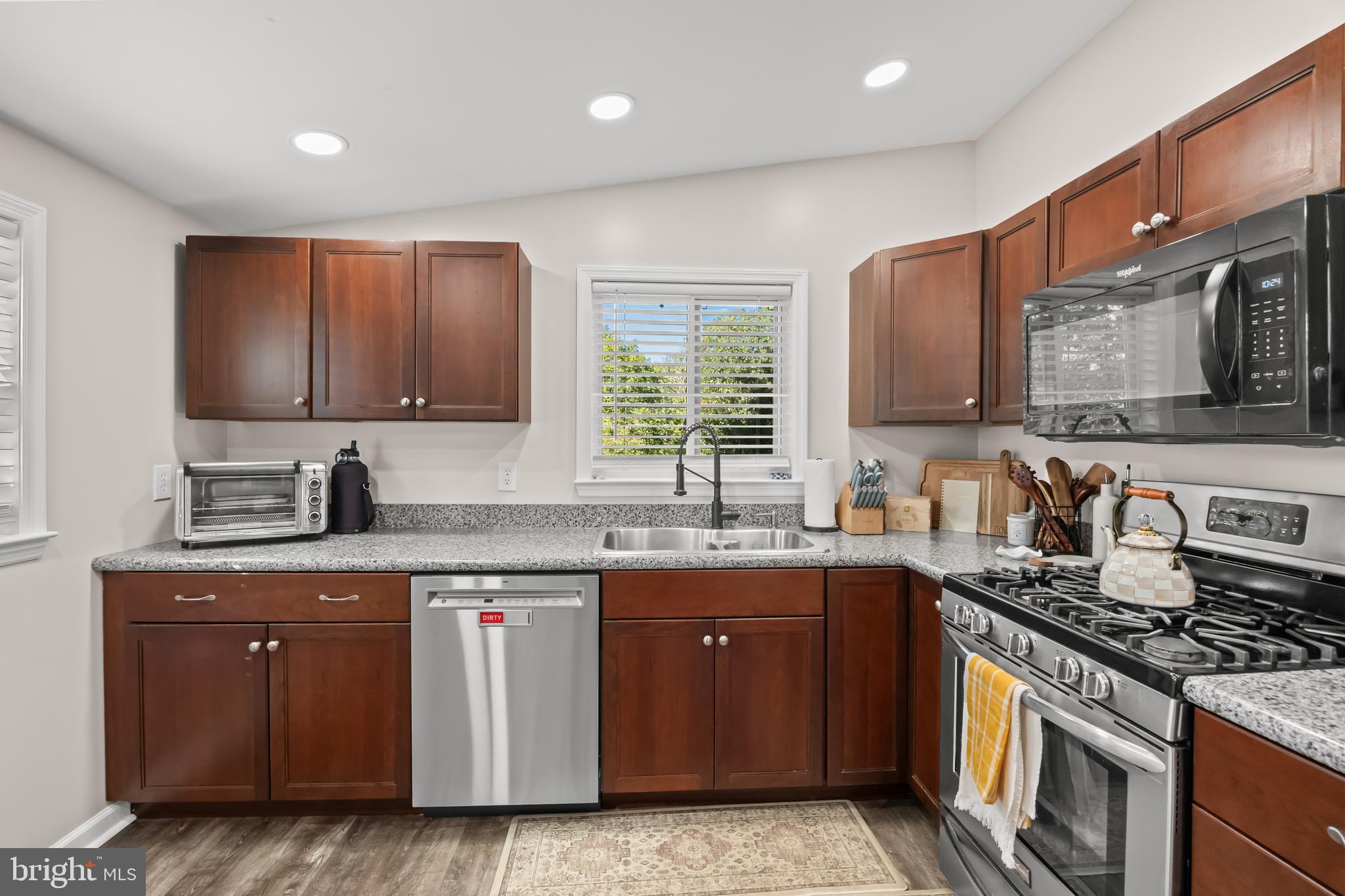 2191 Garwood Road Sicklerville, NJ 08081 - Photo 12 of 36 a kitchen with stainless steel appliances granite countertop a stove a sink dishwasher and a microwave