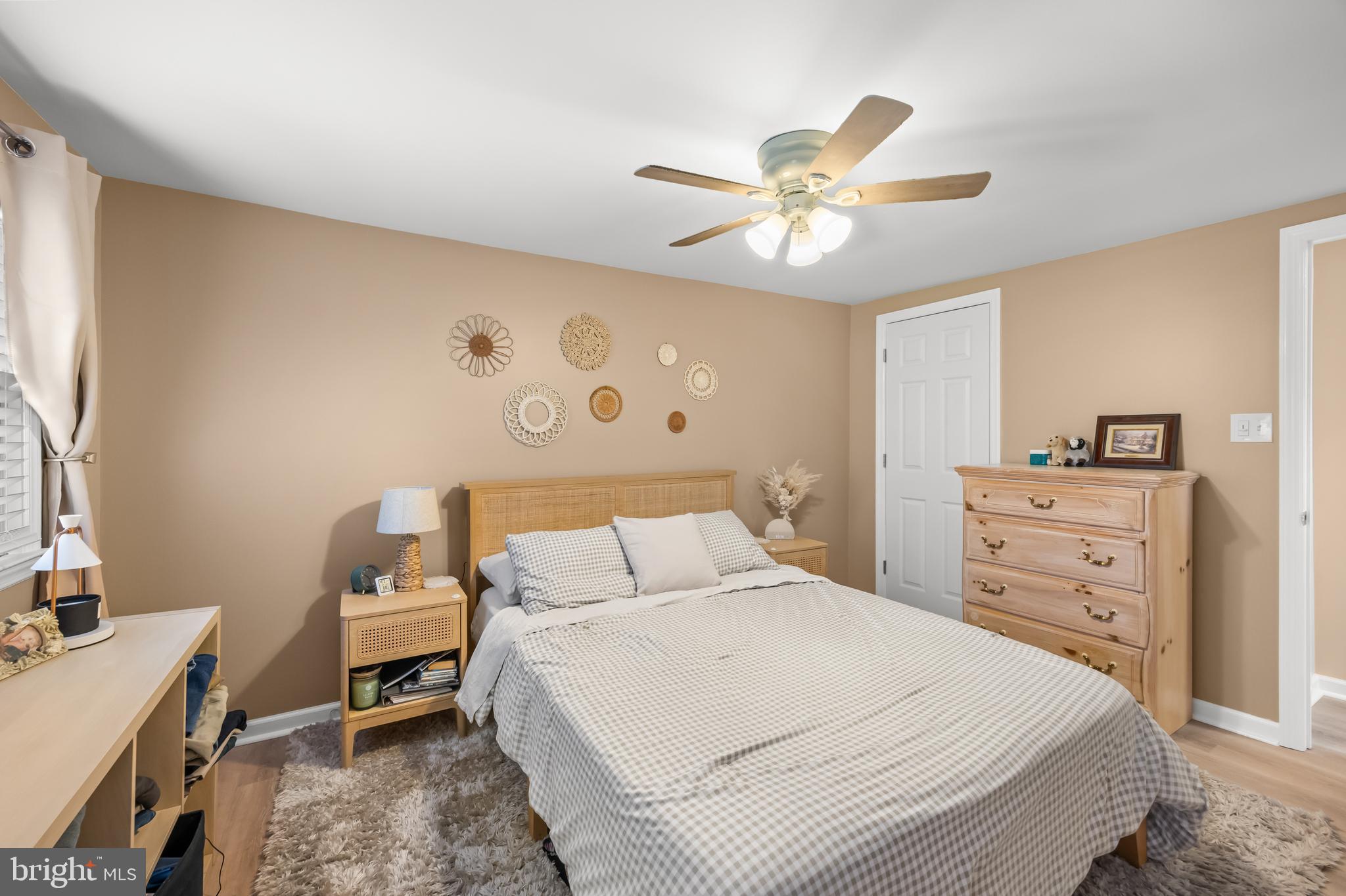 2191 Garwood Road Sicklerville, NJ 08081 - Photo 17 of 36 a bedroom with a bed and a chandelier