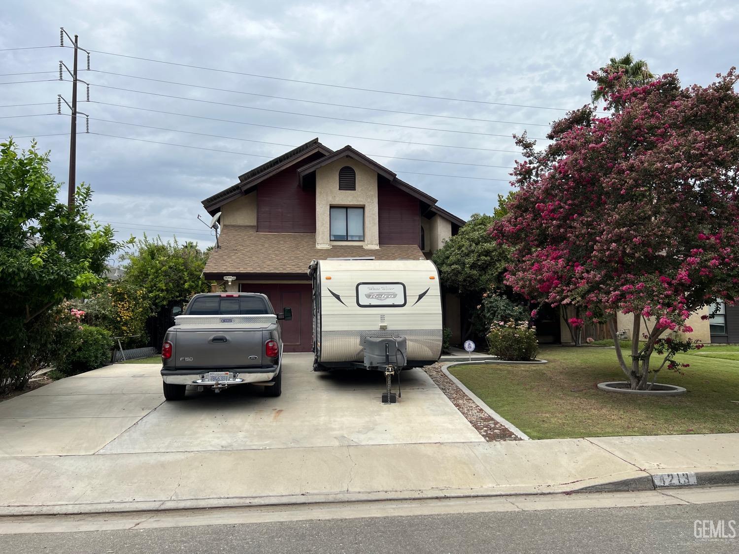 Undisclosed Address Bakersfield, CA 93311 - Photo 3 of 14 a car parked on the side of a street
