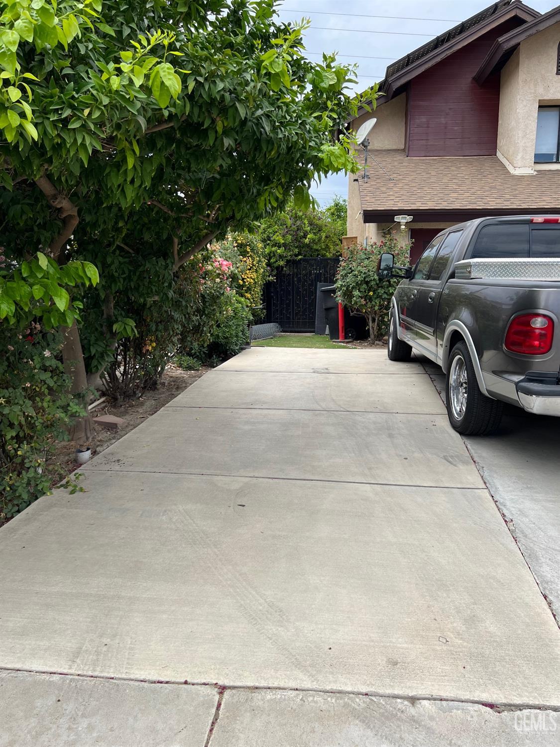 Undisclosed Address Bakersfield, CA 93311 - Photo 4 of 14 a view of a car parked in front of a house