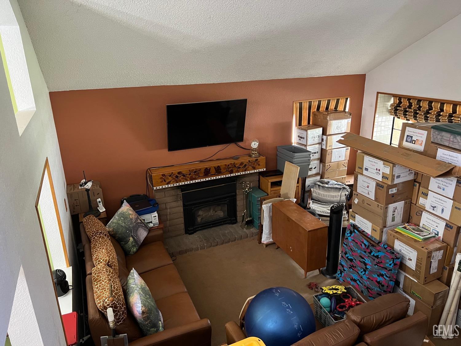 Undisclosed Address Bakersfield, CA 93311 - Photo 5 of 14 a living room with furniture and a flat screen tv