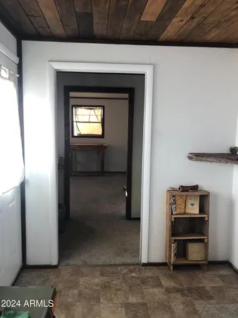 a view of an empty room and a window
