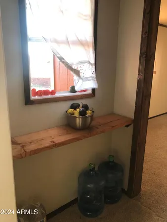 a bathroom with a sink and a window