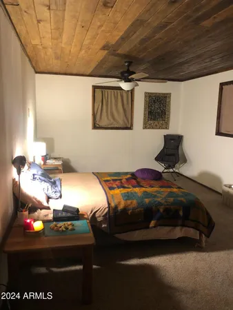 a bedroom with a bed and a machine