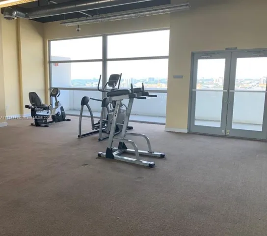 a view of a room with gym equipment
