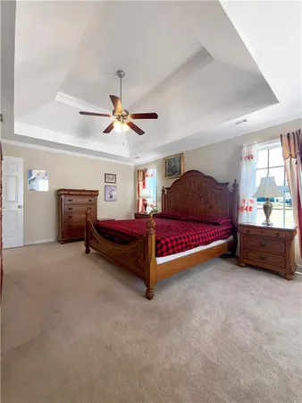 a bedroom with furniture and window