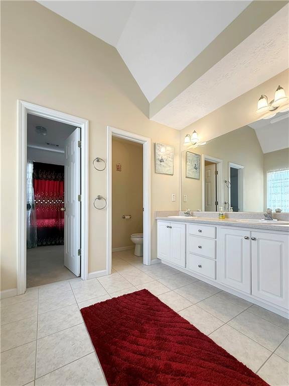 235 Shiver Boulevard Covington, GA 30016 - Photo 17 of 27 a spacious en suite bathroom with a double vanity sink and mirror