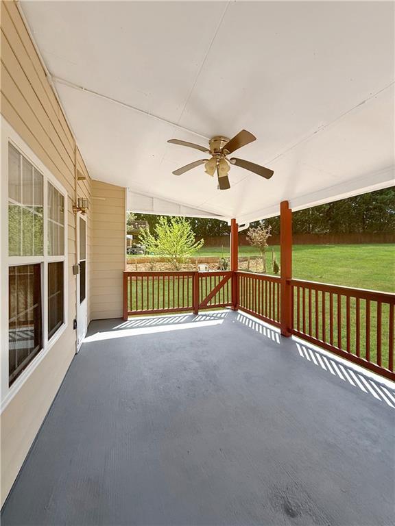 235 Shiver Boulevard Covington, GA 30016 - Photo 20 of 27 a view of a balcony with a floor to ceiling window and wooden fence
