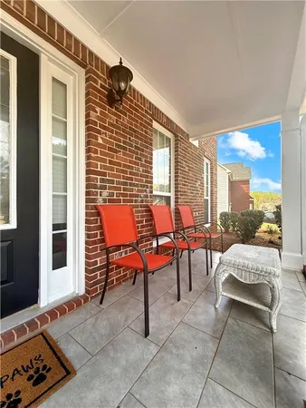 a outdoor space with patio furniture and a potted plant