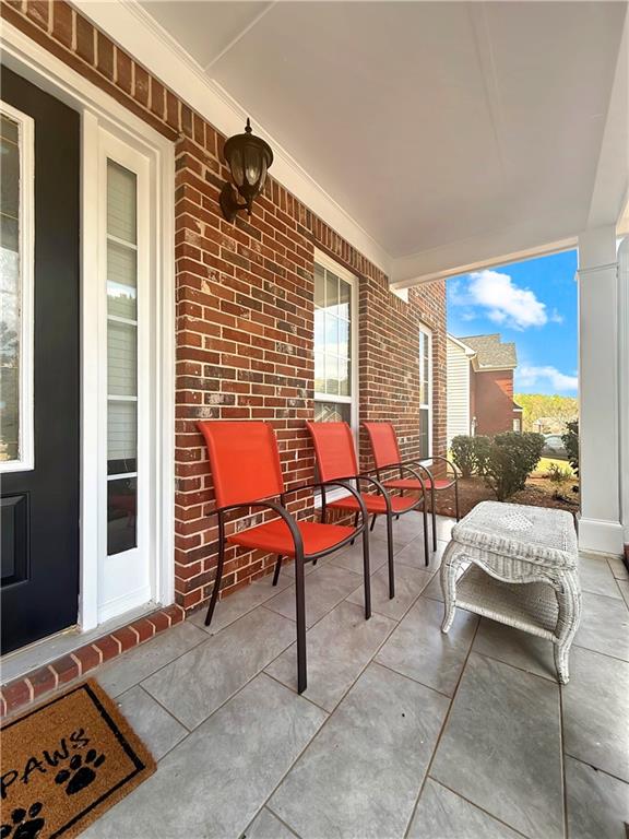 235 Shiver Boulevard Covington, GA 30016 - Photo 2 of 27 a outdoor space with patio furniture and a potted plant