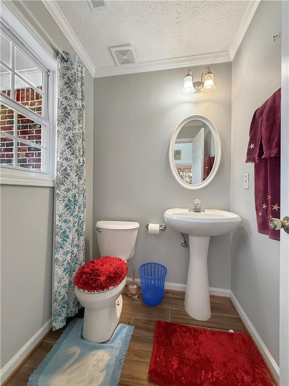 235 Shiver Boulevard Covington, GA 30016 - Photo 21 of 27 a bathroom with a sink toilet and a mirror