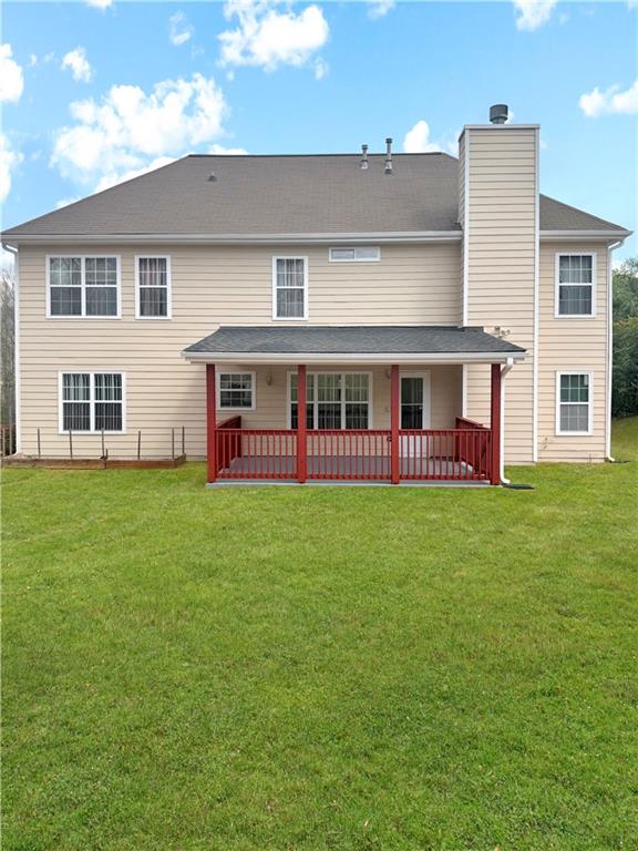 235 Shiver Boulevard Covington, GA 30016 - Photo 26 of 27 a view of a house with a big yard and large trees