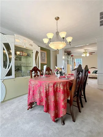 a bed room with a bed and a chandelier
