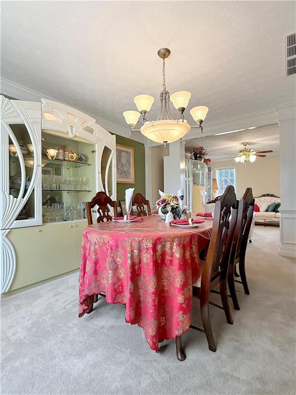 235 Shiver Boulevard Covington, GA 30016 - Photo 8 of 27 a bed room with a bed and a chandelier